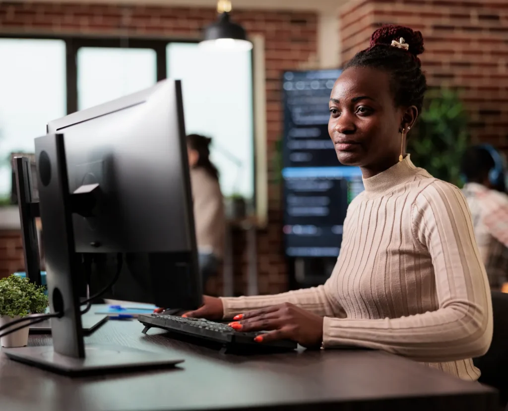 woman looking at her computer screen