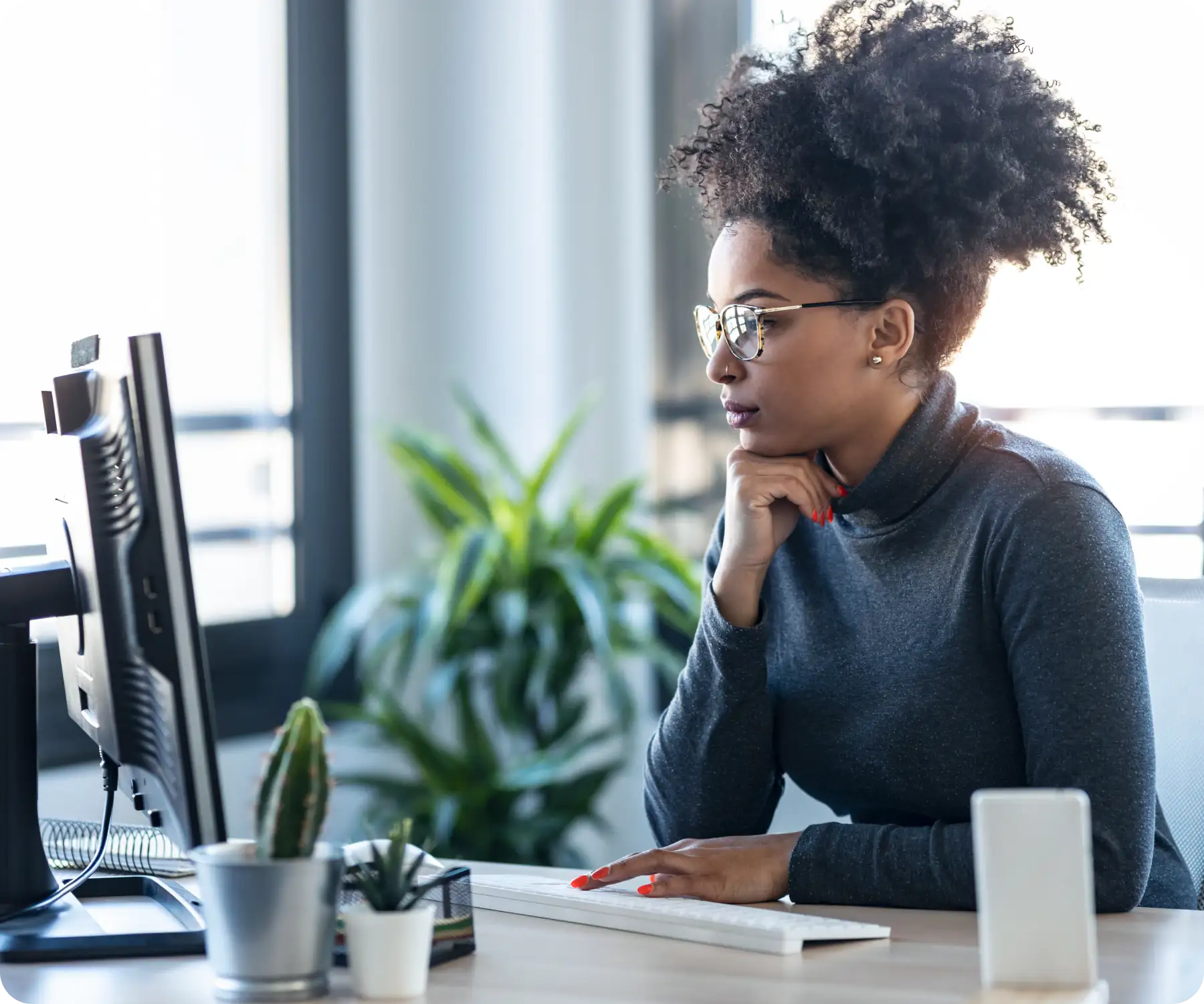woman looking at her computer screen