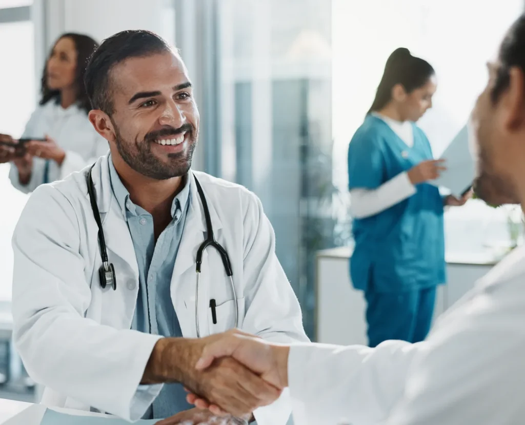 Doctor shaking patients hand Health-HR-Company