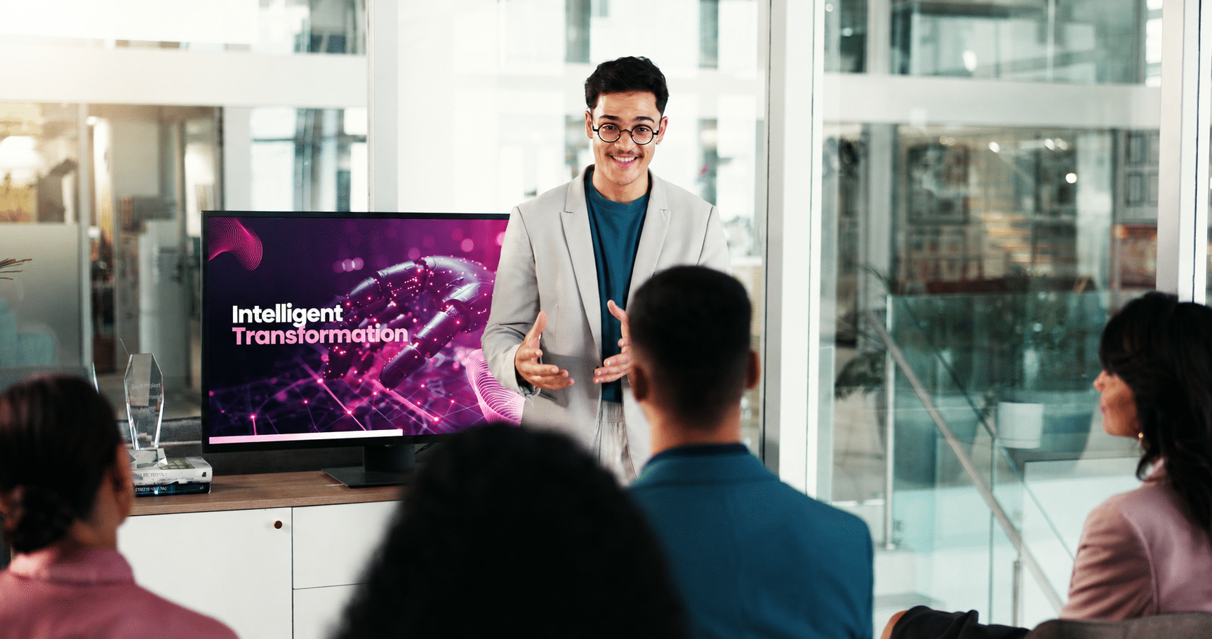 Business professional presenting intelligent transformation strategies to an enterprise audience.